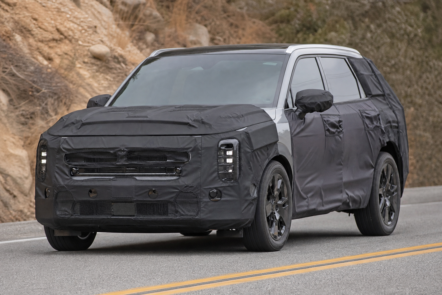 Next generation kia sportage enters testing with boxier design